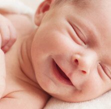 Why do babies smile in their sleep