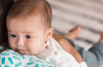 baby spitting up clear liquid