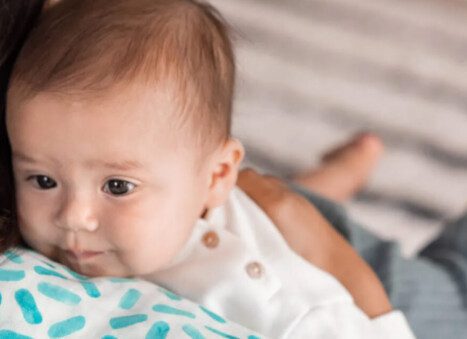 baby spitting up clear liquid