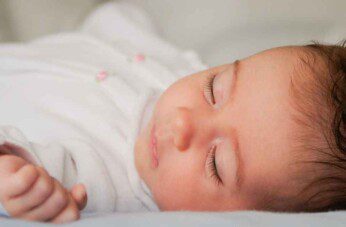 newborn rolls to side while sleeping