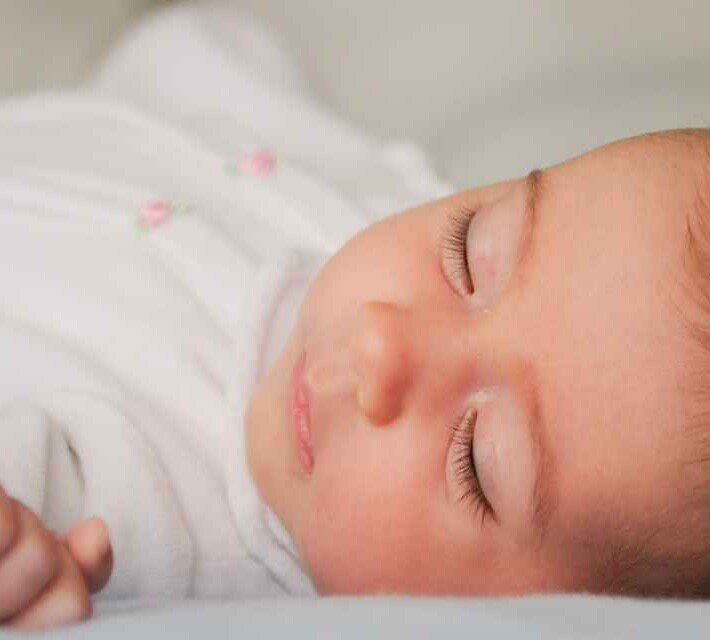 newborn rolls to side while sleeping